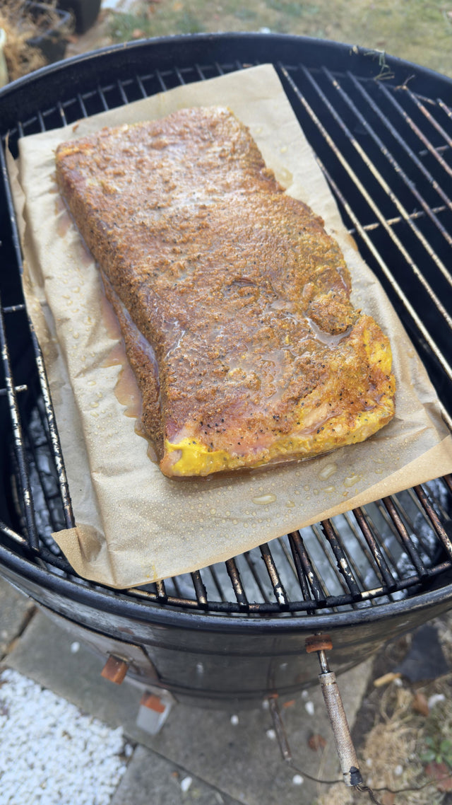 Customer review photo: seasoned beef flat brisket on a kettle barbecue