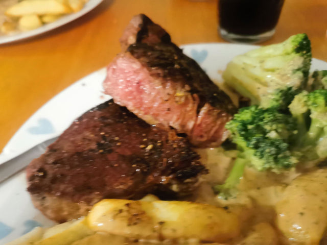 Customer review photo: cooked ribeye steak dinner with vegetables