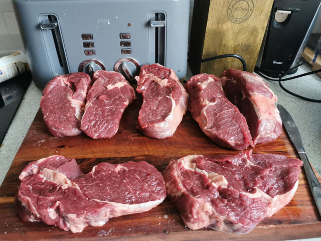 Customer review photo: ribeye steaks cut from a whole Gaucho ribeye on a board