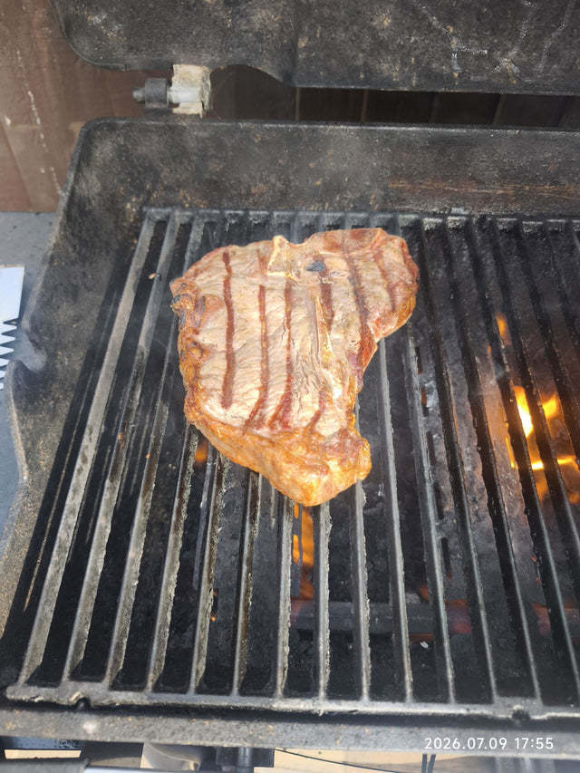 T-bone steak cooking on a griddle pan – customer photo of a meatsupermarket.com T-bone steak