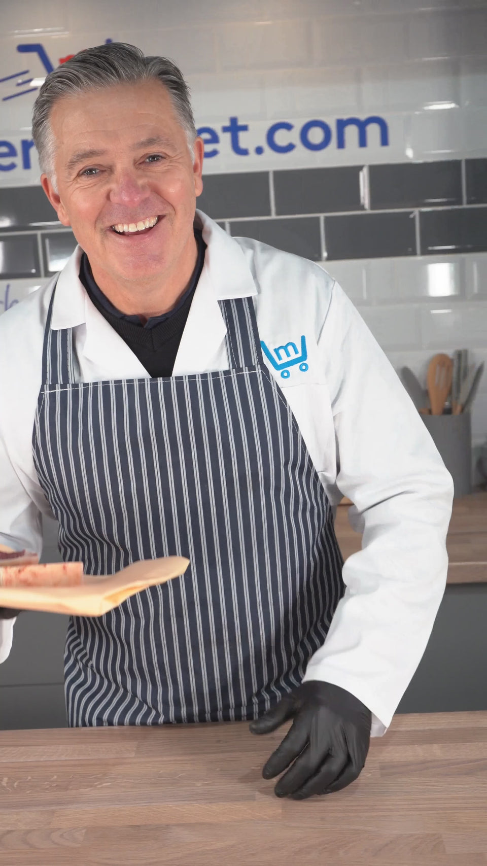 Our butcher showing two free sirloin steaks for new customers of our online butcher
