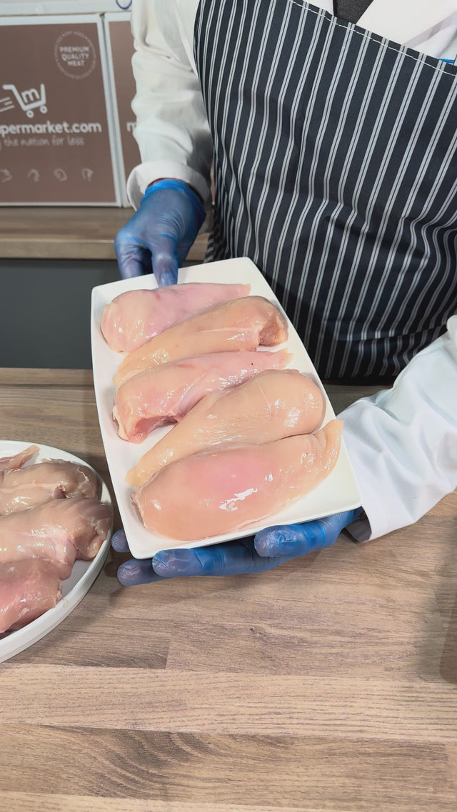 Our butcher showing a tray of chicken breast fillets