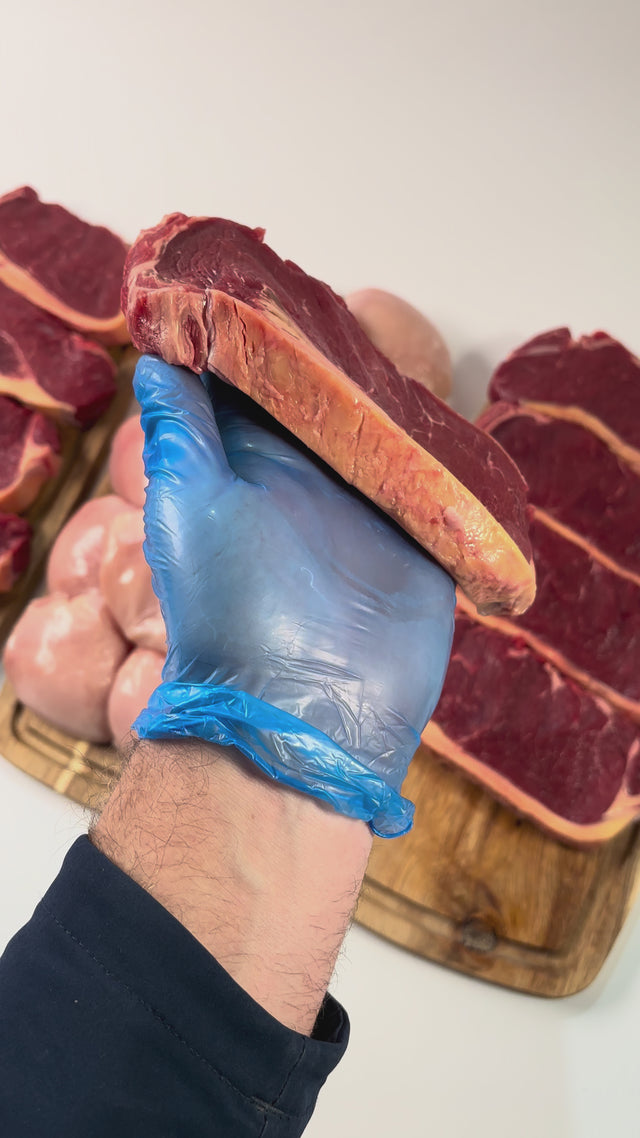 Our butcher showing packs of steak at the meatsupermarket.com counter